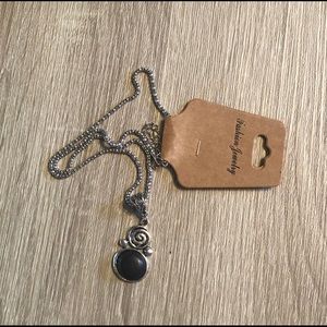 Silver spiral necklace with black stone